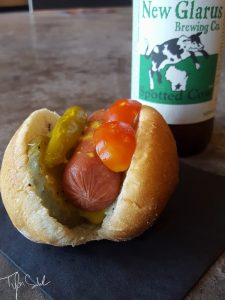 A Chicago couple gets married in Stoughton, of course mini hot dogs and New Glarus are in order